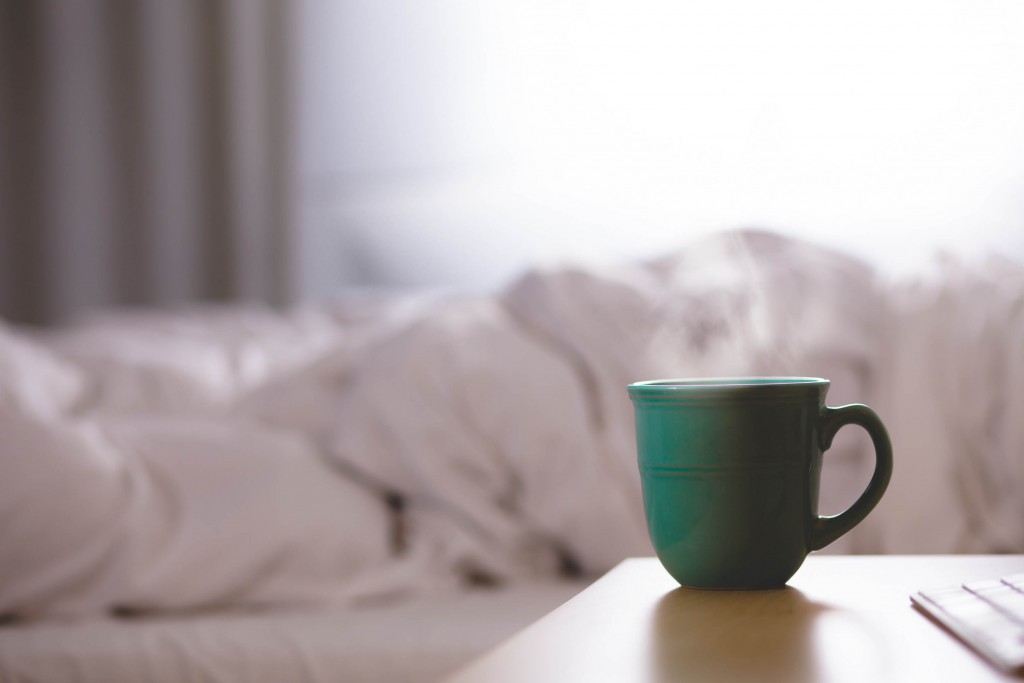 steaming cup of tea in bed