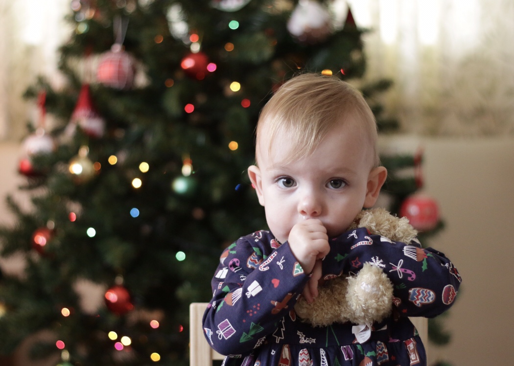 Eleanor in front of the Christmas tree