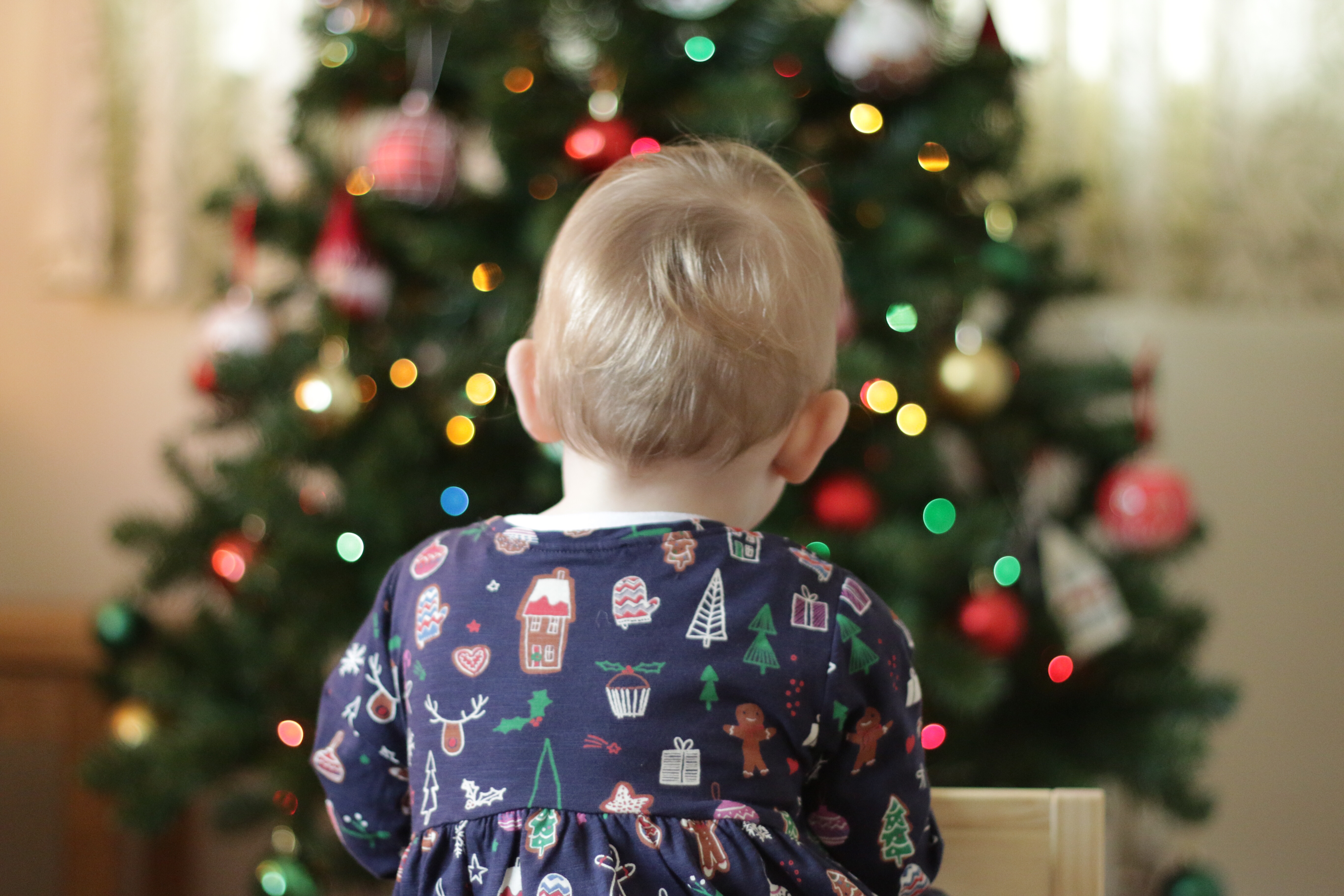 Eleanor in front of the Christmas tree