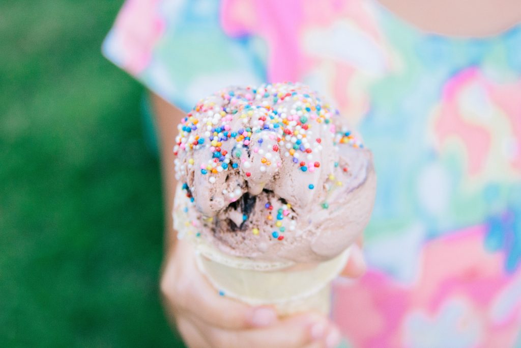 a child holding an ice cream - image by Jenny Smith from Unsplash