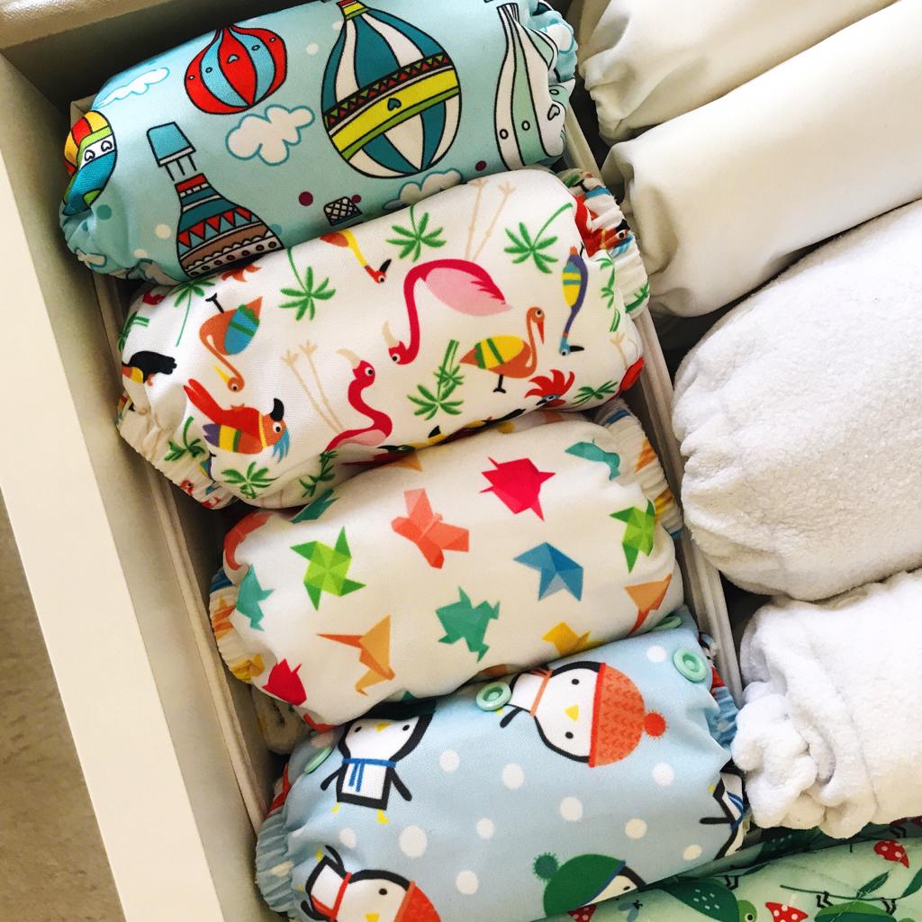 Cloth nappies in a draw. How to get started with cloth nappies.